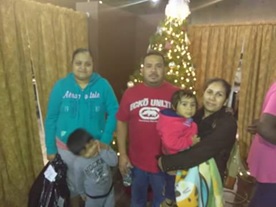 Family receiving toys for Christmas